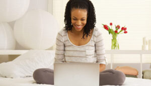 Student Taking Real Estate Exam On Laptop