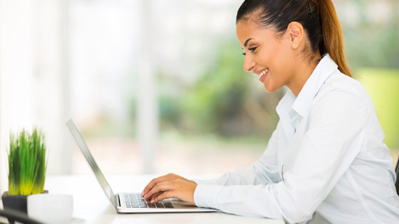 Woman Studying On A Computer